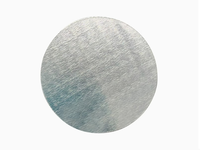 a silver circle with a white background