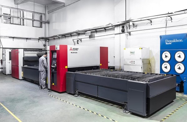 High-precision industrial laser cutting machine in a manufacturing facility.