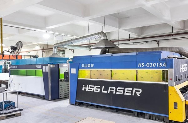 Advanced industrial laser cutting equipment in a manufacturing facility. Precise, high-speed cutting technology ideal for metal fabrication and engineering projects.