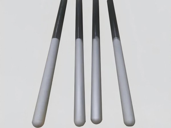 Golf club shafts with black grips and silver tips arranged in a row, perfect for golf enthusiasts and sports equipment retailers.