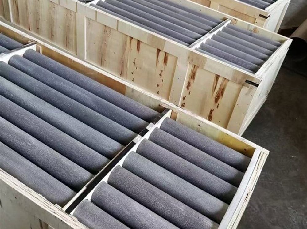 High-quality tungsten carbide grinding rollers displayed in wooden crates for industrial use, emphasizing durability and precision in grinding applications.
